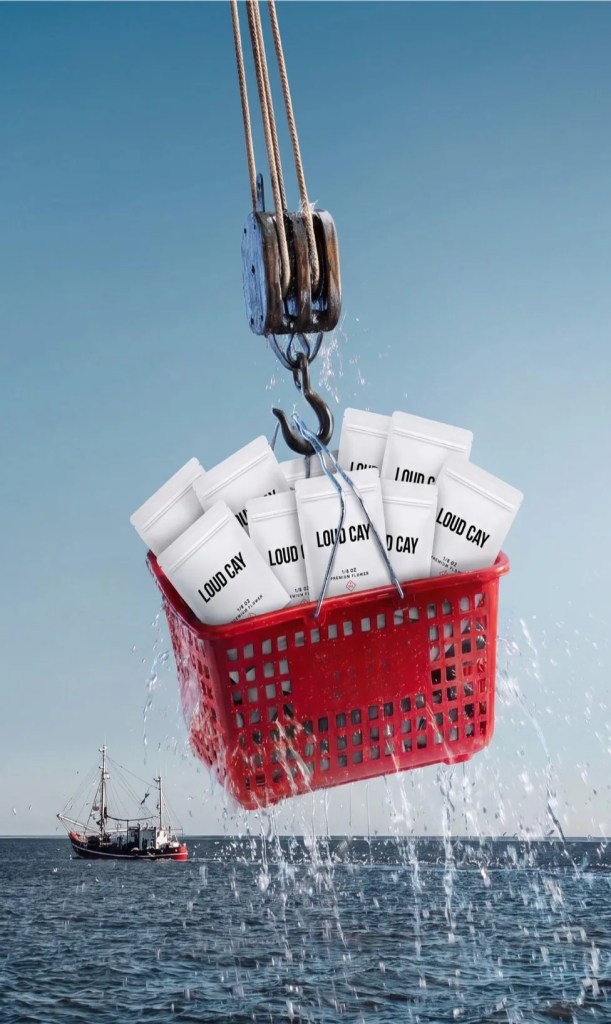 Basket of Loud Cay flower pouches hoisted over the water